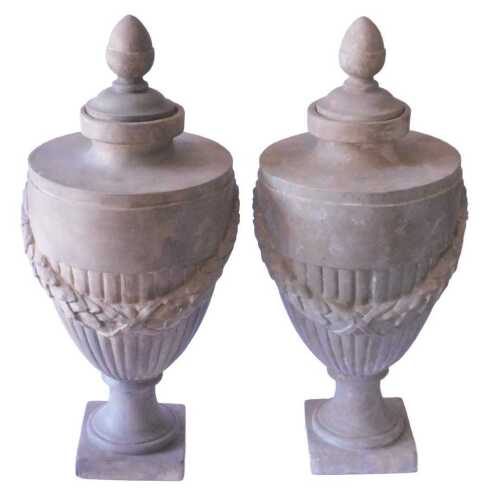 A pair of Neoclassical style urns and covers, by Richard Taylor Designs, the domed lid with...