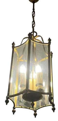 An octagonal brass hanging lantern, with glass panels and fittings for three bulbs, 56cm high...
