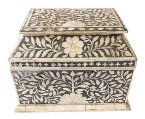 An Eastern bone inlaid chest, the domed top enclosing a vacant interior, decorated overall with...