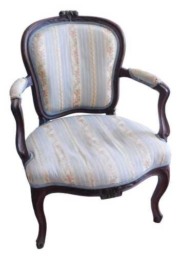 A 19thC French beech fauteuil, with a moulded frame decorated with flowers, with a padded back,...