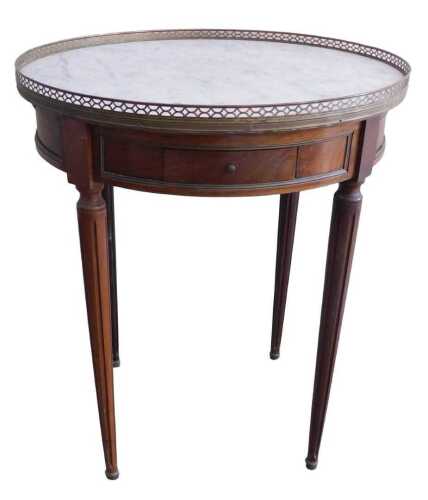 A French mahogany Empire style occasional table, the circular marble top with a pierced brass...