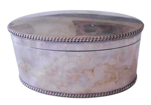 A silver plated oval box and cover, with beaded borders, the hinged lid enclosing a vacant...