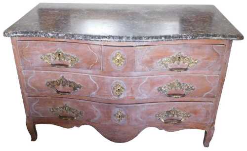 A 19thC French Provincial chestnut serpentine fronted commode, the dark grey variegated marble...