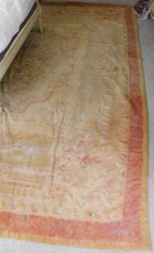 A French Aubusson style rug or hanging, decorated with flowers, on a beige ground, one narrow...