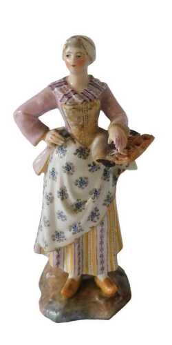 A German porcelain figure of a lady with bread, on a shaped base, stylised cross swords mark to...