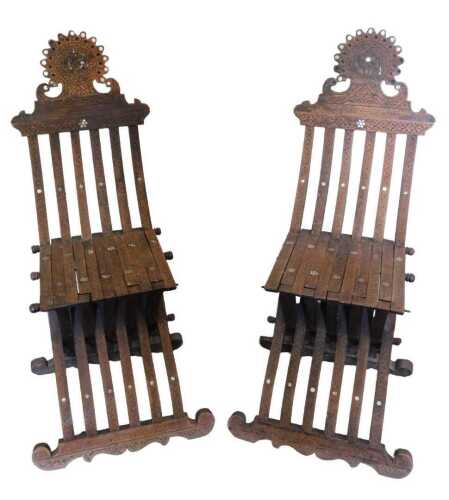 A pair of 19thC Syrian hardwood and mother-of-pearl inlaid folding chair, each with a shaped...