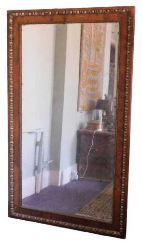A pair of walnut and parcel gilt rectangular wall mirrors, (only one illustrated) the frames...