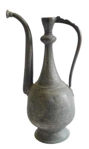 An Eastern copper ewer, with engraved decoration of flowers, leaves, etc., on a domed foot,...