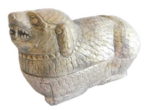 A brass Cambodian betel nut box and cover, in the form of a dog of fo, 23cm long. Offsite Sale -...