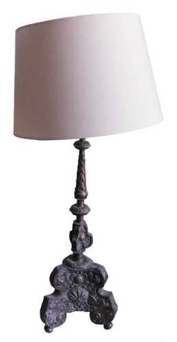 A pair of Continental embossed brass altar style lamp bases, each with baluster stem, triform...