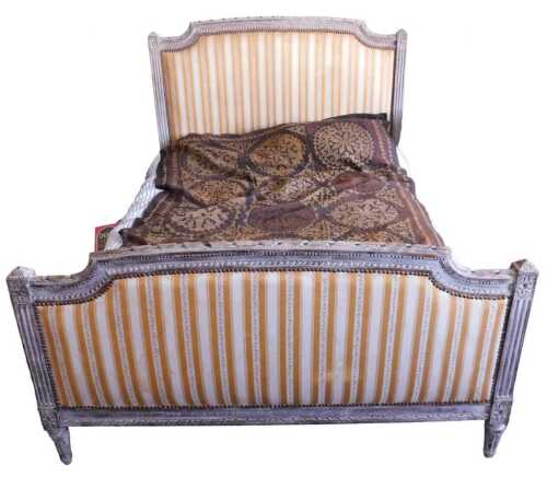 A French grey painted bed, the moulded frame decorated with ribbons, with a padded headboard and...