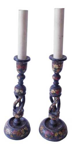 A pair of Indian Kashmir table lamps, each painted with flowers, on a black ground, 47cm high....