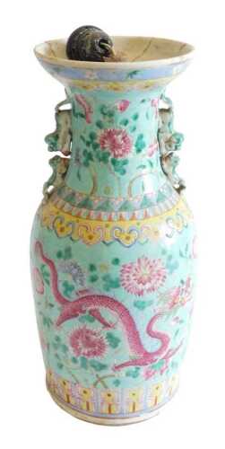 A late 19thC Chinese Canton decorated two handled vase, decorated with dragon, flowers, etc., on...