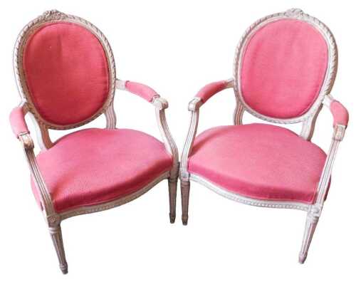A pair of 19thC French cream painted beech fauteuil, each with a red upholstered padded back,...