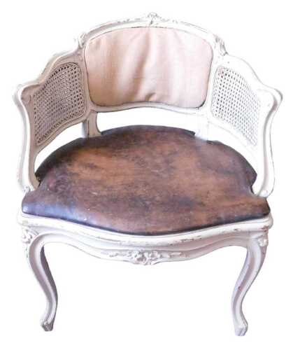 A late 19th/early 20thC Continental cream painted tub chair, the moulded frame with padded back,...