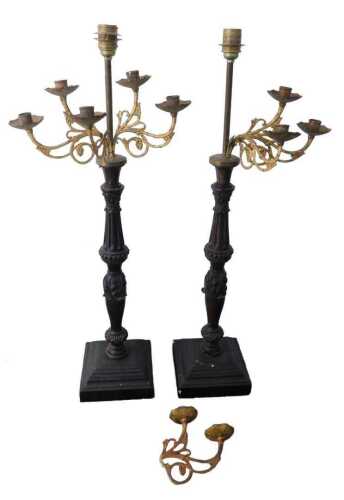 A pair of French mahogany and gilt metal table lamps, each with six arms, on turned leaf carved...