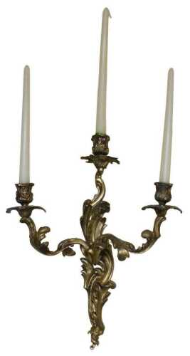 A pair of late 19thC Louis XV style rococo style gilt metal three-branch wall sconces, each with...