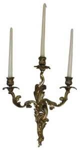 A pair of late 19thC Louis XV style rococo style gilt metal three-branch wall sconces, each with...