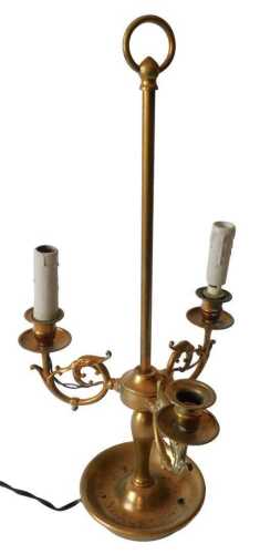 A French brass and gilt metal table lamp, with three scrolling arms, on a dished base, with...