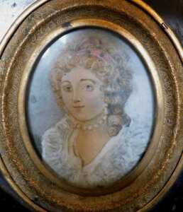 A 19thC oval portrait miniature of a lady, in white dress and pearl necklace, stipple engraving... - 2