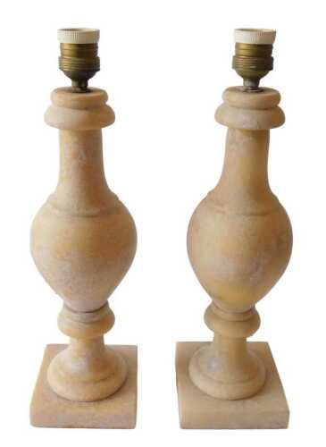 A pair of Continental cream coloured alabaster baluster shaped table lamps, on a square base,...