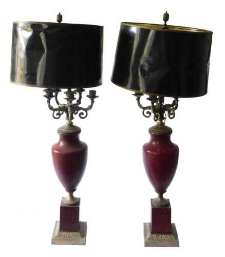 A pair of French toleware table lamps, each painted in red to simulate marble, with gilt metal...