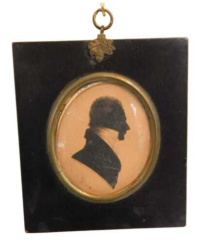 An early 19thC oval portrait silhouette of a gentleman, black ink, 8.5cm x 6.5cm. Offsite Sale -...