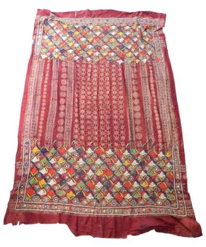 An Indian hanging, with a design to each end of multicoloured lozenges, some with mirrored...