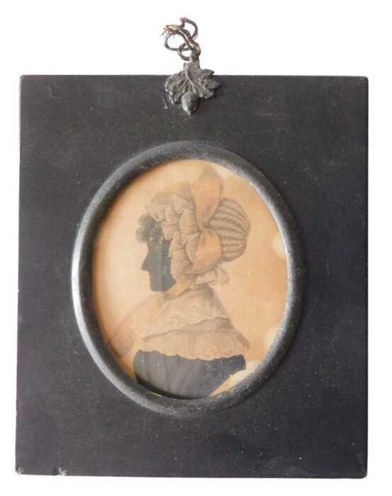 A 19thC silhouette portrait miniature. Head and shoulders study of a lady in profile,...