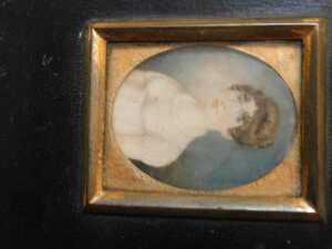 An early 19thC oval portrait miniature, of a young lady in a white silk dress, 5.5cm x 6.5cm.... - 2