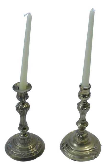 A pair of 19thC gilt brass rococo candlesticks, each with urn dish holders, raised on inverted...