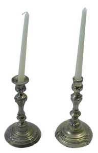 A pair of 19thC gilt brass rococo candlesticks, each with urn dish holders, raised on inverted...