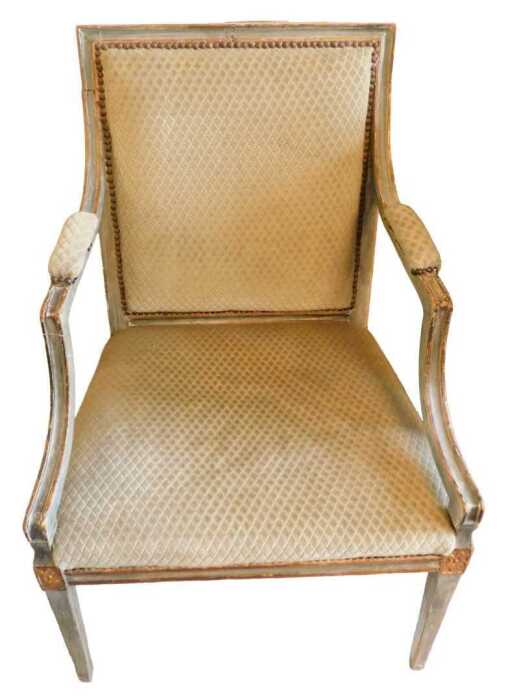 A 19thC Louis XVI style fauteuil armchair or elbow chair, with moulded arm supports, on square...