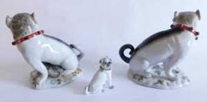 A pair of Continental Meissen style porcelain pug dogs groups, the first with standing dog and... - 2