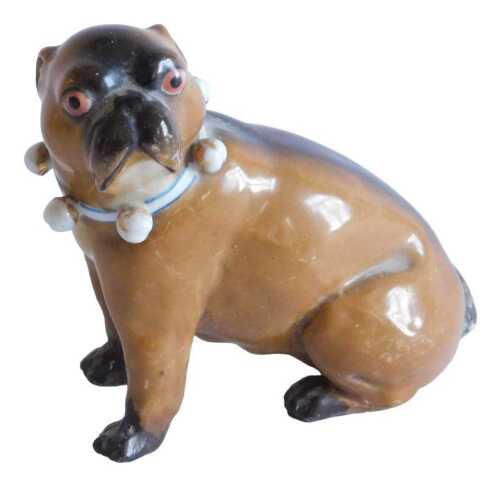 A very early 20thC Meissen porcelain figure of a standing pug dog, with orange eyes and blue and...