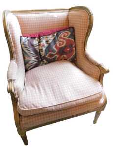 A Louis XVI style giltwood wing chair, with deep back and seat, on tapering turned legs, with...