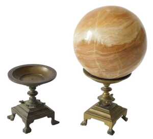 A brown onyx orb or globe, mounted on late 19thC French brass stand, 22cm high, and another...