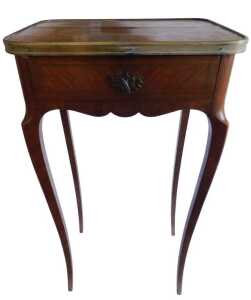 An early 20thC Louis XVI style kingwood table, the quarter veneered rectangular top with metal...