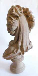 A French painted terracotta bust of a lady, in 18thC style, quarter profile, on turned socle,... - 2