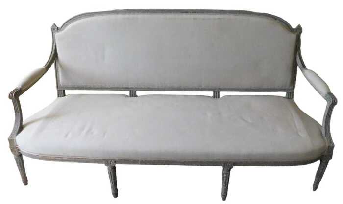 A 19thC painted French settee, with shaped oval back, with heavily carved acanthus leaf finials,...