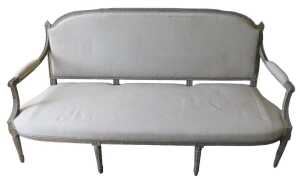A 19thC painted French settee, with shaped oval back, with heavily carved acanthus leaf finials,...