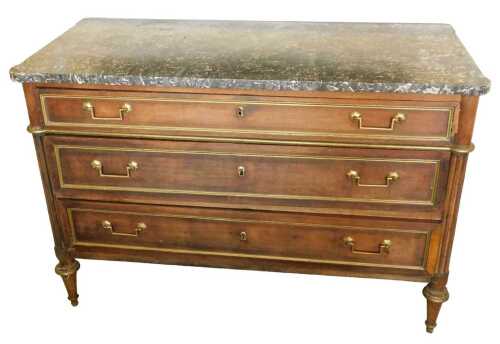 A French Empire mahogany commode, with black marble top, raised above three ormolu mounted...