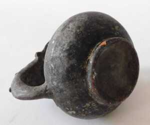 A Continental black glazed terracotta jug, the border and handle decorated with roundels, 15cm... - 4