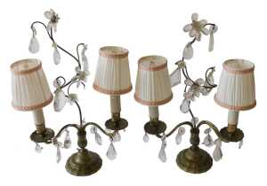 A pair of French two branch candelabra, each with urn dish holders, on shaped feet, with cut...