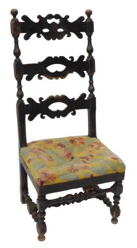 A late 19thC French beech stained ladder back chair, with elaborate pierced horizontal splats,...