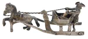 A 19thC miniature model of a figure in sleigh being pulled by a horse, with realistic reigns,...