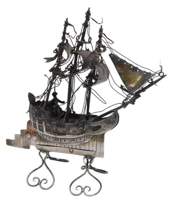 A 19thC miniature model of a ship, with realistic decking, rigging, and articulated sails, on...