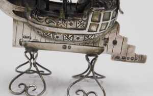 A 19thC miniature model of a ship, with realistic decking, rigging, and articulated sails, on... - 2