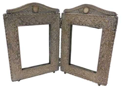 A 20thC two fold photograph frame, hinging at the centre, each section of rectangular form with...