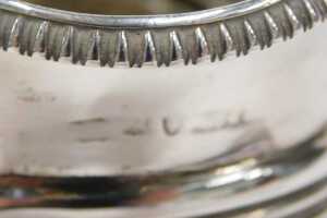 A George III silver milk jug, with strap angular handle, gadrooned rim and reeded body on... - 2